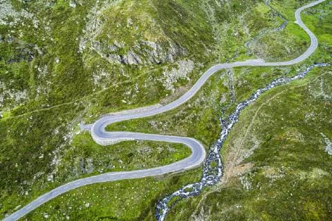 Aerial view Curvy pass road Flüelapass with clouds Graubünden canton Switzerland Europe Copyright: imageBROKER/StefanxSchurr ibxssc04743601.jpg