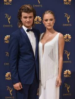 Actors Joe Keery (L) and Maika Monroe attend the 70th annual Primetime Emmy Award at the Microsoft Theater in downtown Los Angeles on September 17, 2018.  LAP20180917072 CHRISTINExCHEW