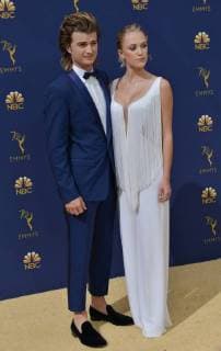 Actors Joe Keery (L) and Maika Monroe attend the 70th annual Primetime Emmy Award at the Microsoft Theater in downtown Los Angeles on September 17, 2018.  LAP20180917073 CHRISTINExCHEW