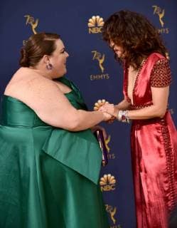 Actors Chrissy Metz (L) and Sandra Oh attend the 70th annual Primetime Emmy Award at the Microsoft Theater in downtown Los Angeles on September 17, 2018.  LAP20180917109 CHRISTINExCHEW