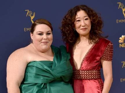 Actors Chrissy Metz (L) and Sandra Oh attend the 70th annual Primetime Emmy Award at the Microsoft Theater in downtown Los Angeles on September 17, 2018.  LAP20180917113 CHRISTINExCHEW
