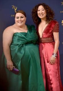 Actors Chrissy Metz (L) and Sandra Oh attend the 70th annual Primetime Emmy Award at the Microsoft Theater in downtown Los Angeles on September 17, 2018.  LAP20180917114 CHRISTINExCHEW