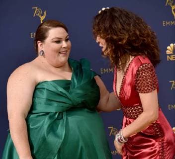 Actors Chrissy Metz (L) and Sandra Oh attend the 70th annual Primetime Emmy Award at the Microsoft Theater in downtown Los Angeles on September 17, 2018.  LAP20180917115 CHRISTINExCHEW