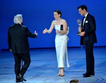 Henry Winkler (L) accepts the Outstanding Supporting Actor in a Comedy Series award for Barry from Claire Foy and Matt Smith onstage during the 70th annual Primetime Emmy Awards at the Microsoft Theater in downtown Los Angeles on September 17, 2018.  LAP20180917571 JIMxRUYMEN