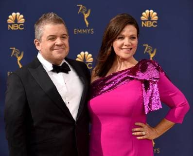 Comedian Patton Oswalt (L) and actor Meredith Salenger attend the 70th annual Primetime Emmy Award at the Microsoft Theater in downtown Los Angeles on September 17, 2018.  LAP20180917203 CHRISTINExCHEW