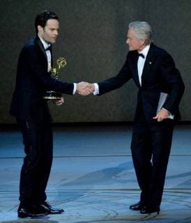 Bill Hader (L) accepts the Outstanding Lead Actor in a Comedy Series award for Barry from Michael Douglas onstage during the 70th annual Primetime Emmy Awards at the Microsoft Theater in downtown Los Angeles on September 17, 2018.  LAP20180917627 JIMxRUYMEN