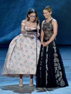 Emilia Clarke (L) and Millie Bobby Brown onstage during the 70th annual Primetime Emmy Awards at the Microsoft Theater in downtown Los Angeles on September 17, 2018.  LAP20180917593 JIMxRUYMEN
