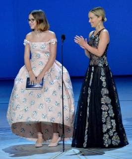 Emilia Clarke (L) and Millie Bobby Brown onstage during the 70th annual Primetime Emmy Awards at the Microsoft Theater in downtown Los Angeles on September 17, 2018.  LAP20180917594 JIMxRUYMEN