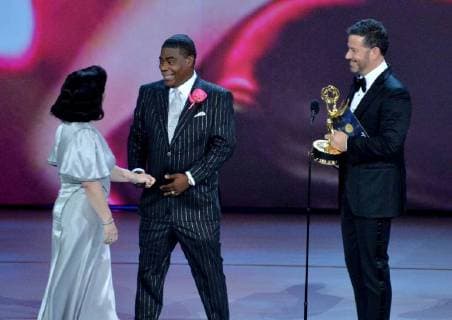 Alex Borstein (L) accepts the Outstanding Supporting Actress in a Comedy Series award for The Marvelous Mrs. Maisel from Tracy Morgan and Jimmy Kimmel (R) onstage during the 70th annual Primetime Emmy Awards at the Microsoft Theater in downtown Los Angeles on September 17, 2018.  LAP20180917598 JIMxRUYMEN