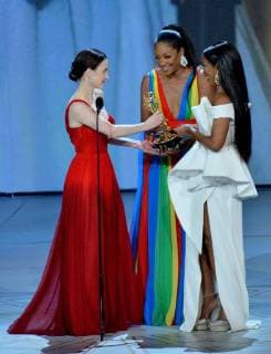 (L-R) Rachel Brosnahan accepts the Outstanding Lead Actress in a Comedy Series award for The Marvelous Mrs. Maisel from Tiffany Haddish and Angela Bassett onstage during the 70th annual Primetime Emmy Awards at the Microsoft Theater in downtown Los Angeles on September 17, 2018.  LAP20180917617 JIMxRUYMEN