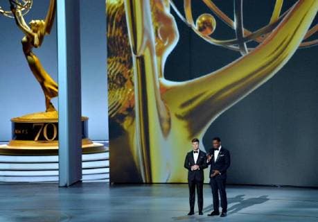 Dave Chappelle (L) and Neal Brennan speak onstage during the 70th annual Primetime Emmy Awards at the Microsoft Theater in downtown Los Angeles on September 17, 2018.  LAP201809171080 JIMxRUYMEN