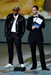 Dave Chappelle (L) and Neal Brennan speak onstage during the 70th annual Primetime Emmy Awards at the Microsoft Theater in downtown Los Angeles on September 17, 2018.  LAP201809171083 JIMxRUYMEN