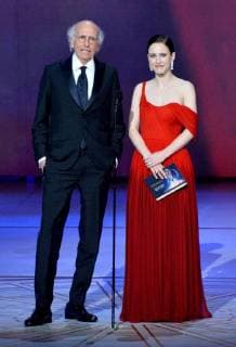 Larry David (L) and Rachel Brosnahan speak onstage during the 70th annual Primetime Emmy Awards at the Microsoft Theater in downtown Los Angeles on September 17, 2018.  LAP201809171103 JIMxRUYMEN