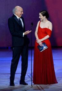 Larry David (L) and Rachel Brosnahan speak onstage during the 70th annual Primetime Emmy Awards at the Microsoft Theater in downtown Los Angeles on September 17, 2018.  LAP201809171105 JIMxRUYMEN