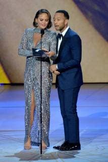 Chrissy Teigen (L) and John Legend speak onstage during the 70th annual Primetime Emmy Awards at the Microsoft Theater in downtown Los Angeles on September 17, 2018.  LAP201809171121 JIMxRUYMEN