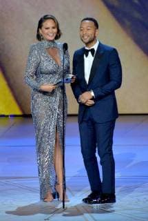 Chrissy Teigen (L) and John Legend speak onstage during the 70th annual Primetime Emmy Awards at the Microsoft Theater in downtown Los Angeles on September 17, 2018.  LAP201809171122 JIMxRUYMEN