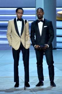 Ron Cephas Jones (L) and Sterling K. Brown speak onstage during the 70th annual Primetime Emmy Awards at the Microsoft Theater in downtown Los Angeles on September 17, 2018.  LAP201809171115 JIMxRUYMEN