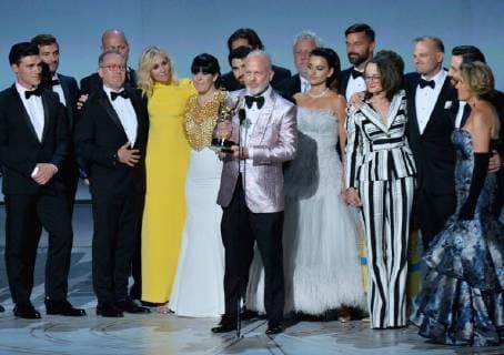 Ryan Murphy (C) surrounded by cast and crew, accepts the Ryan Murphy for The Assassination of Gianni Versace: American Crime Story onstage during the 70th annual Primetime Emmy Awards at the Microsoft Theater in downtown Los Angeles on September 17, 2018.  LAP201809172010 JIMxRUYMEN