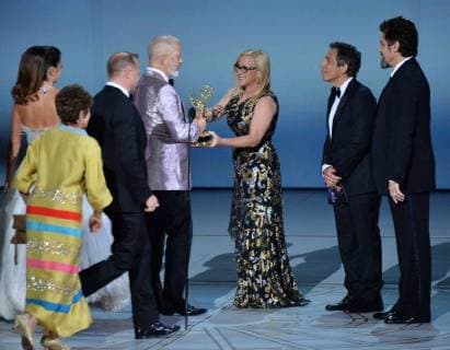 Ryan Murphy (C) surrounded by cast and crew, accepts the Ryan Murphy for The Assassination of Gianni Versace: American Crime Story onstage during the 70th annual Primetime Emmy Awards at the Microsoft Theater in downtown Los Angeles on September 17, 2018.  LAP201809172006 JIMxRUYMEN