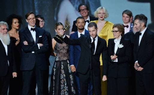 Writer-producers D.B. Weiss (C) and David Benioff (R) and the cast of Game of Thrones accept the award Outstanding Drama series onstage during the 70th annual Primetime Emmy Awards at the Microsoft Theater in downtown Los Angeles on September 17, 2018.  LAP201809172011 JIMxRUYMEN