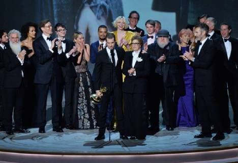 Writer-producers D.B. Weiss (C) and David Benioff (R) and the cast of Game of Thrones accept the award Outstanding Drama series onstage during the 70th annual Primetime Emmy Awards at the Microsoft Theater in downtown Los Angeles on September 17, 2018.  LAP201809172012 JIMxRUYMEN