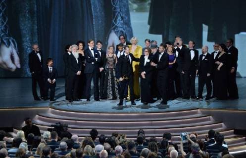 Writer-producers D.B. Weiss (C) and David Benioff (R) and the cast of Game of Thrones accept the award Outstanding Drama series onstage during the 70th annual Primetime Emmy Awards at the Microsoft Theater in downtown Los Angeles on September 17, 2018.  LAP201809172014 JIMxRUYMEN