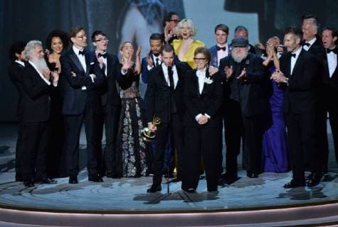 Writer-producers D.B. Weiss (C) and David Benioff (R) and the cast of Game of Thrones accept the award Outstanding Drama series onstage during the 70th annual Primetime Emmy Awards at the Microsoft Theater in downtown Los Angeles on September 17, 2018.  LAP201809172015 JIMxRUYMEN