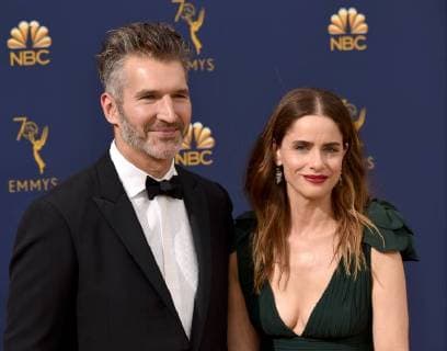 Screenwriter David Benioff (L) and actor Amanda Peet attend the 70th annual Primetime Emmy Award at the Microsoft Theater in downtown Los Angeles on September 17, 2018.  LAP201809171181 CHRISTINExCHEW
