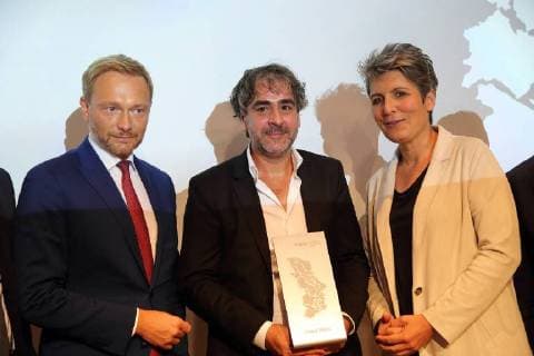 Christian Lindner FDP M100 Media Award Winner Deniz Yücel Die Welt and Ines Pohl Editor-in-Chief Deutsche Welle v l at the M100 Media Award ceremony at the Potsdam Museum in Potsdam 18 September 2018 M100 Media Award