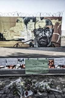 Graffiti of the shot clan Mitlgied Nidal R at the Tatoirt in Berlin Tempelhof