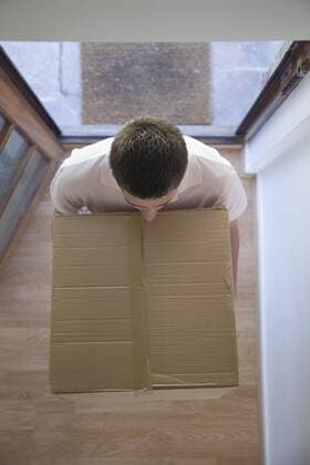 A man carrying a carboard box  Copyright: Ableimages fStopImages481031
