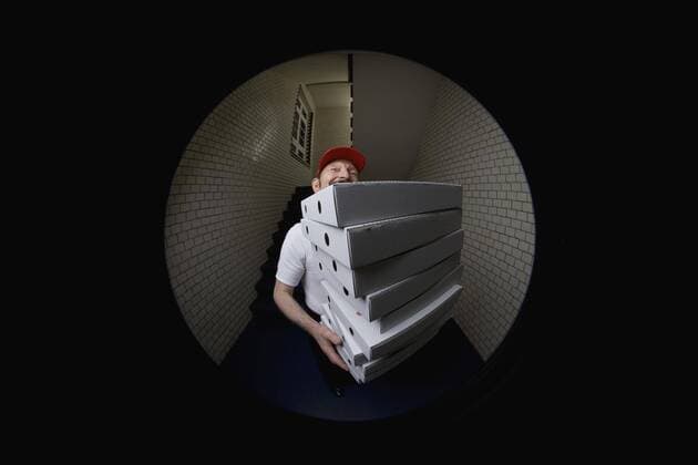 A pizza delivery man, portrait  Copyright: Halfdark fStopImages745003