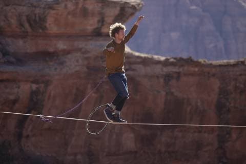 Andy Lewis highlining in Moab Utah, Moab Utah United States Copyright: JaredxAlden 4517100019