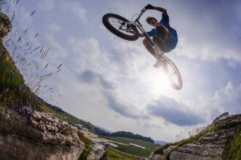 Acrobatic biker on trial bike model released Symbolfoto  GIOF04102