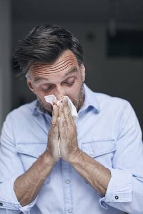 Portrait of man blowing nose model released Symbolfoto  PNEF00832