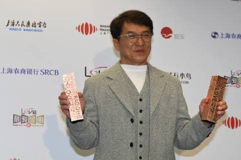 Hong Kong kungfu superstar Jackie Chan poses with his trophies during the 2018 Love Radio Music Awards ceremony in Shanghai, China, 26 September 2018. Jackie Chan wins big at Love Radio Music Awards in Shanghai  20180926_31387