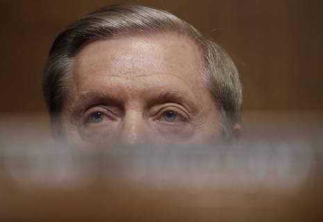U.S. Senator Lindsey Graham (R-SC) listens during a Senate Judiciary Committee confirmation hearing with professor Christine Blasey Ford, who has accused U.S. Supreme Court nominee Brett Kavanaugh of a sexual assault in 1982, on Capitol Hill in Washington, U.S., September 27, 2018.  WAX20180927323 JIMxBOURG