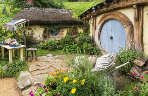 Hobbiton, wooden doors of Hobbit holes in the film set fictional village of Hobbiton, Matamata, North Island, New Zealand, Pacific Copyright: NealexClark 698-3358 Editorial Use Only