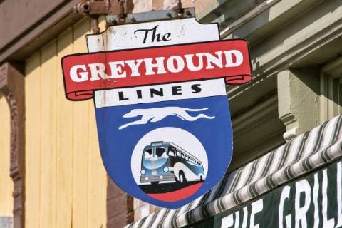 Old sign of the Greyhound bus line in historic downtown Atlanta on Route 66 Atlanta Illinois USA