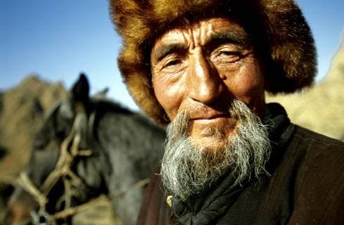 Portrait of a Kazakh Nomad in traditional dressing. Most of the nomads living in the Tavanbogd Atlai National Park are Kazakhs., Tavanbogd National Park Mongolia Copyright: OlivierxRenck 7282600039