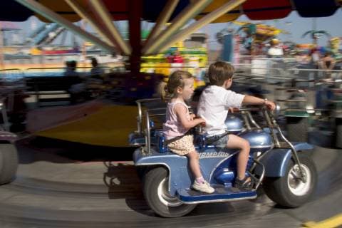 Finn and Myla McLain at play in Old Orchard Beach amusement park in Southern Maine., Old Orchard Beach Maine USA model released Symbolfoto Copyright: DavidxMcLain 7627000039