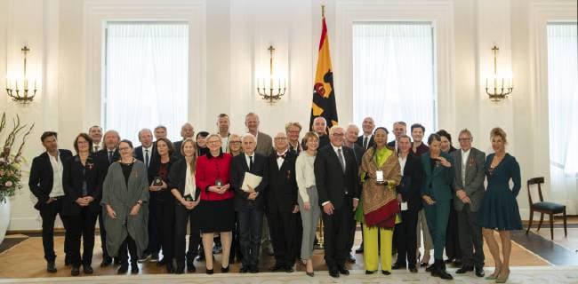 Federal President Frank Walter Steinmeier 11R and his wife Buedenbender 13R pose for a group photo with the recipient of the Cross of Merit of the Order of Merit of the Federal Republic of Germany at Bellevue Palace in Berlin on 2 October 2018 Award of Merit in Berlin