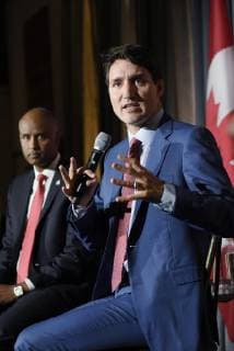October 2, 2018 - Toronto, Canada - Prime Minister Justin Trudeau speaking while Ahmed Hussen -the Minister of Immigration, Refugees and Citizenship is listening during an armchair conversation at an open Liberal fundraising event in Toronto on October 2, 2018. Toronto Canada  - ZUMAn230 20181002_zaa_n230_761 Copyright: xArindamxShivaanix