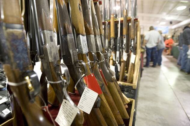 Rows of guns for sale at a gun show in Oregon. (Note: Resellers information removed from gun hang tags to protect the resellers privacy), Oregon United States of America Copyright: JonathanxKingston 9854800003