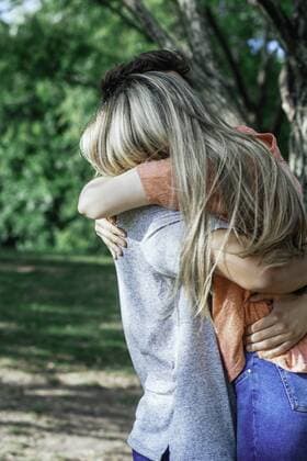 Couple hugging in park  Copyright: FrédéricxCirou B65463435