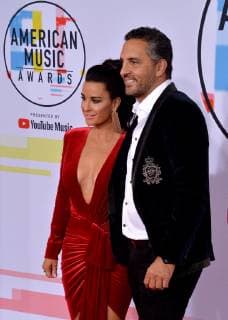Actress Kyle Richards (L) and real estate agent Mauricio Umansky arrive for the 46th annual American Music Awards at the Microsoft Theater in Los Angeles on October 9, 2018.  LAP20181009232 JIMxRUYMEN
