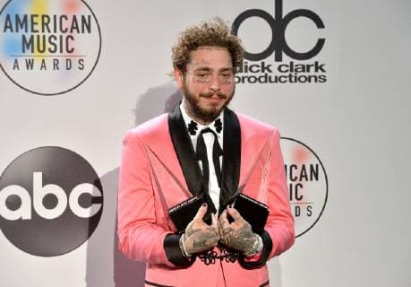 Rapper Post Malone appears backstage with his award for Favorite Male Artist - Pop Rock, during the 46th annual American Music Awards at the Microsoft Theater in Los Angeles on October 9, 2018.  LAP20181009544 JIMxRUYMEN