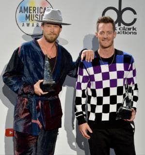 Brian Kelley and Tyler Hubbard (R) of Florida Georgia Line appear backstage with their award for Favorite Duo or Group - Country, during the 46th annual American Music Awards at the Microsoft Theater in Los Angeles on October 9, 2018.  LAP20181009578 JIMxRUYMEN