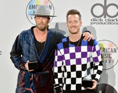 Brian Kelley and Tyler Hubbard (R) of Florida Georgia Line appear backstage with their award for Favorite Duo or Group - Country, during the 46th annual American Music Awards at the Microsoft Theater in Los Angeles on October 9, 2018.  LAP20181009579 JIMxRUYMEN