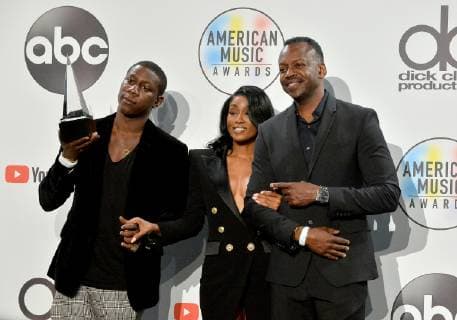 Cleopatra Bernard (C) who accepted the award for Favorite Album - Soul R&B on behalf of XXXTentacion, appears backstage during the 46th annual American Music Awards at the Microsoft Theater in Los Angeles on October 9, 2018.  LAP20181009582 JIMxRUYMEN